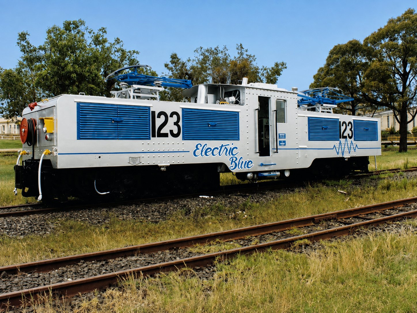 Restored historical photograph of Yallourn electric locomotive No. 123, Electric Blue, with blue shutters and pantographs.
