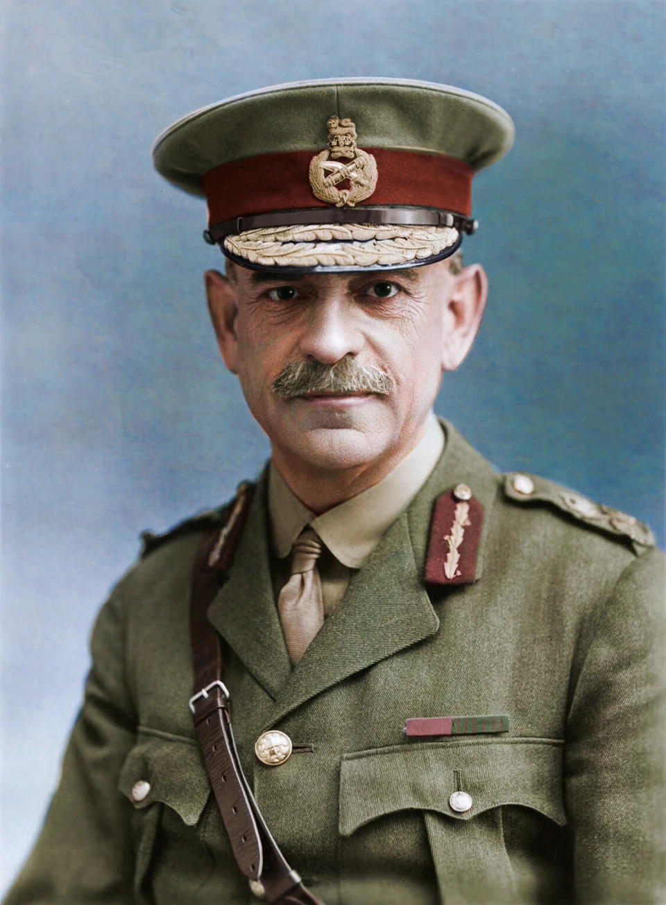 Speculatively colourised portrait of John Monash in field uniform and peaked cap in 1918.