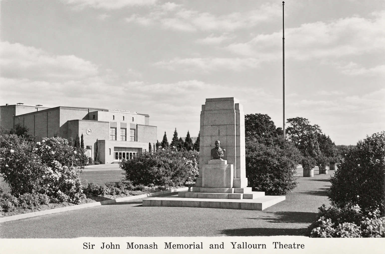 Restored black-and-white postcard view of the Sir John Monash memorial and flagpole among formal gardens, with Yallourn Theatre on the left.