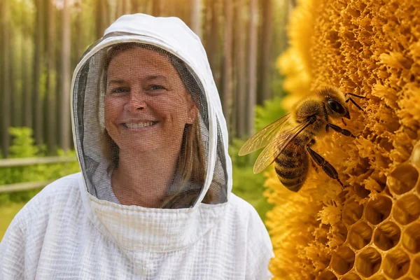 An illustrated beekeeper beside bees and honeycomb