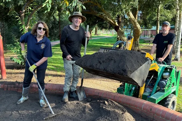 Volunteers working on a garden bed