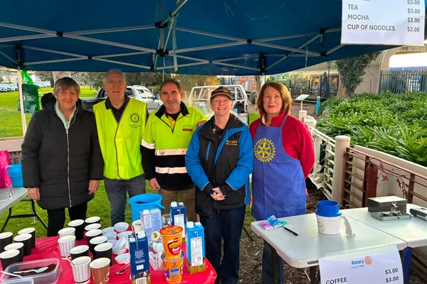 Rotary Club volunteers at an outdoor refreshment stall