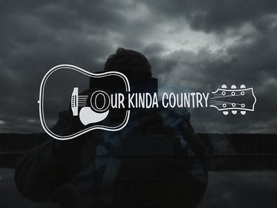 A graphic of an acoustic guitar outline with the text 'Our Kinda Country' on a dark moody background.