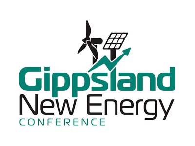 A wide conference hall filled with delegates attending a renewable energy forum, with a stage and presentation screen visible at the front.