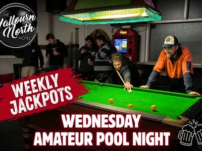 A player in an orange high-vis shirt leaning over a green pool table lining up a shot, surrounded by onlookers at the Yallourn North Hotel.