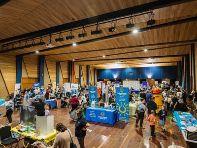 Children and families enjoying activities at a community expo inside Kernot Hall, Morwell.