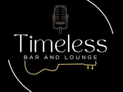 DJ Brenno standing at his decks inside Timeless Bar and Lounge, wearing a dark vest and red tie, with a stylised jazz mural behind him.