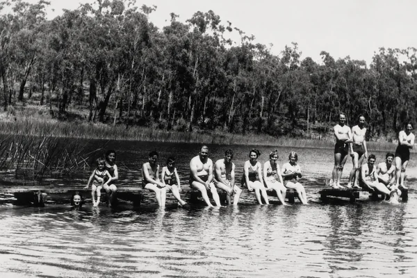 Historic black-and-white photograph of a group swimming at an outdoor waterhole near Moe