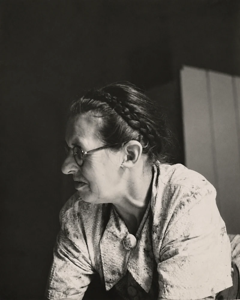 An undated black-and-white profile portrait of Jean Galbraith wearing glasses.