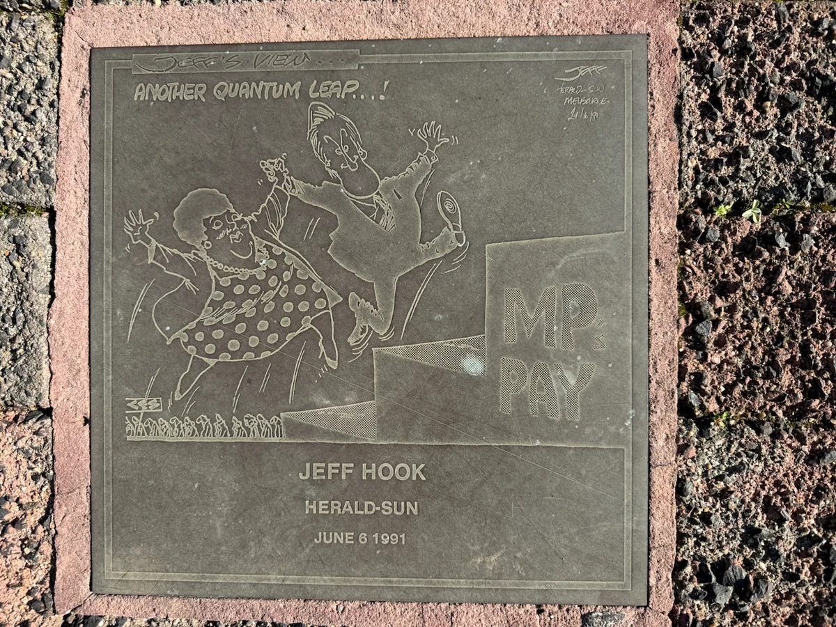 Original photograph of Jeff Hook’s engraved 6 June 1991 Herald-Sun cartoon plaque in the Moe footpath.