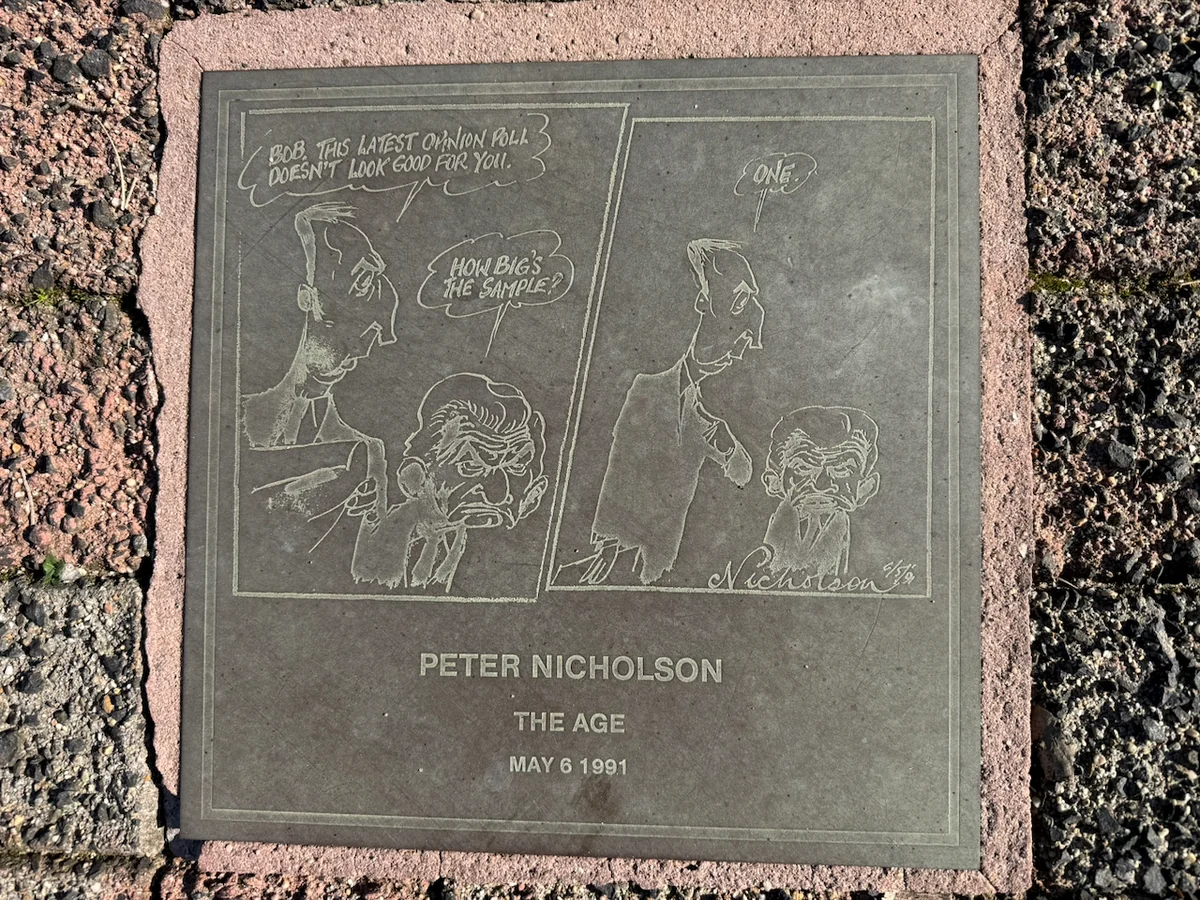 A second original photograph of Peter Nicholson’s engraved 6 May 1991 cartoon plaque in the Moe footpath.