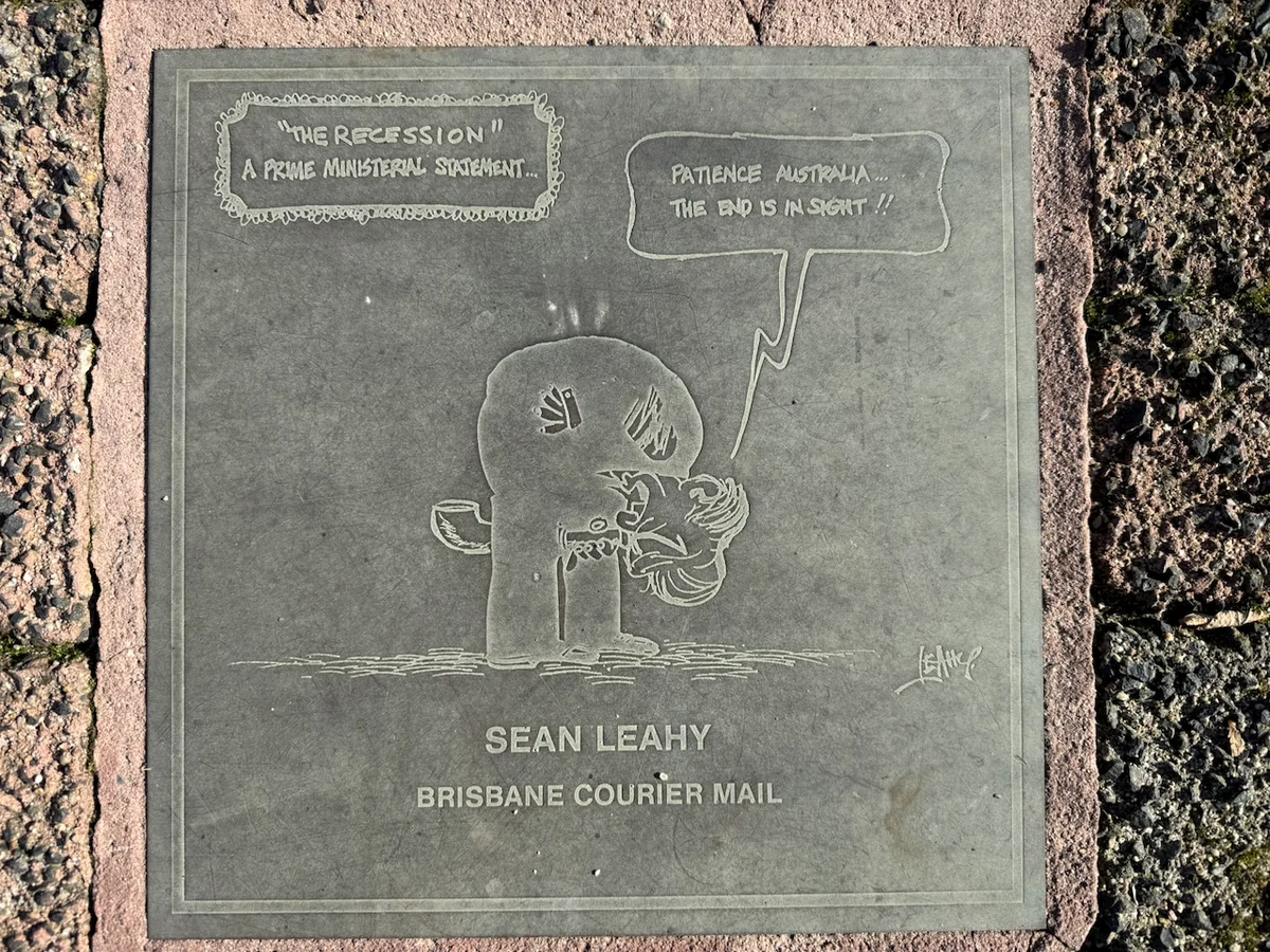 Original photograph of Sean Leahy’s engraved Brisbane Courier Mail cartoon plaque in the Moe footpath.