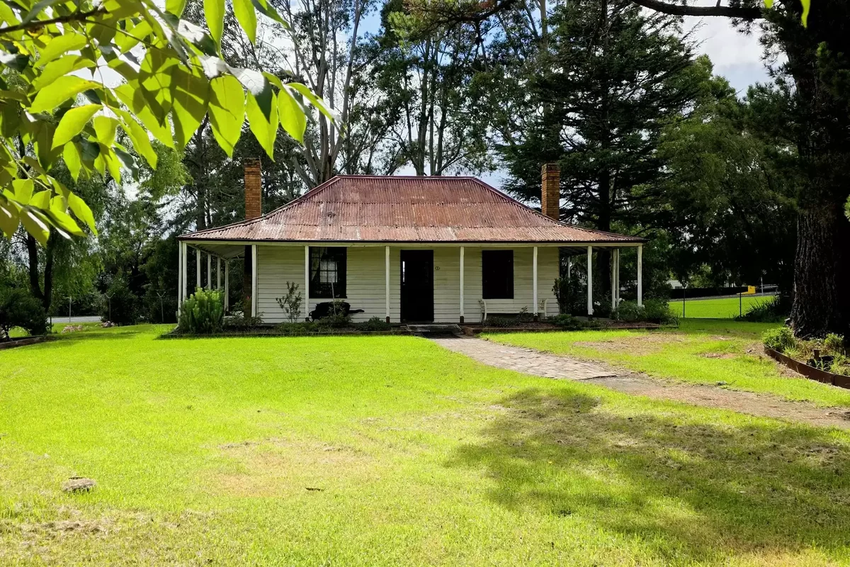 Bushy Park Homestead's timber verandah and garden at Old Gippstown Heritage Park.