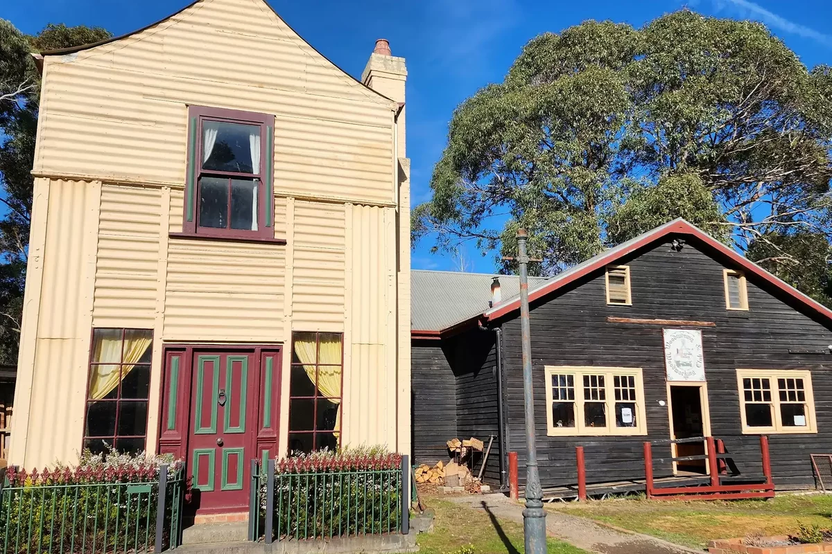 The corrugated-iron Loren house stands among trees at Old Gippstown Heritage Park.