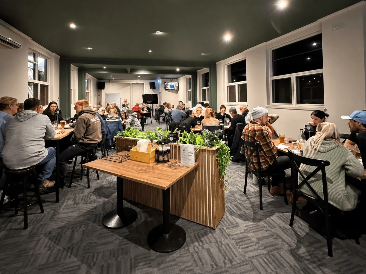 Patrons dining in the busy Newborough Hotel dining room.