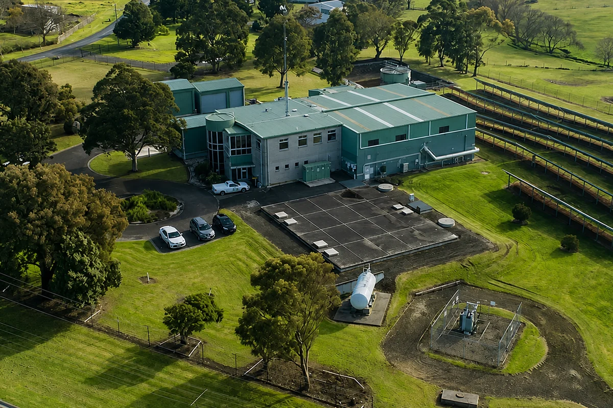 Aerial view of the Traralgon water-treatment facility among trees and open grassland.