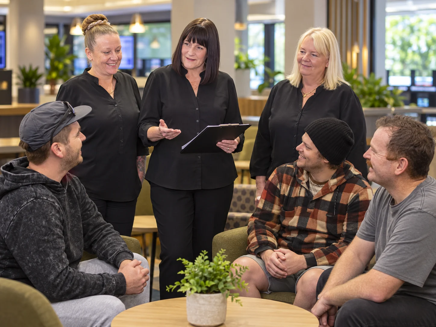 Interpretive scene of venue staff discussing responsible service and customer wellbeing
