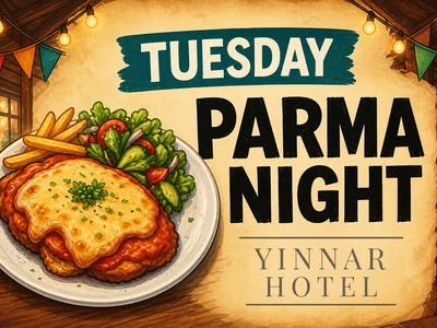 A pub meals board at a country hotel advertising parma night, steak night and karaoke with colourful bunting and warm lights.