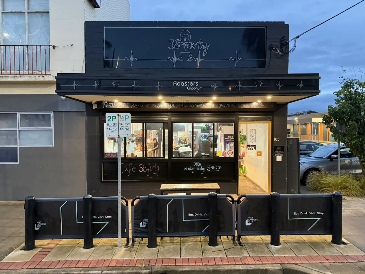 38Forty Cafe frontage at 185 Princes Drive in Morwell, with its entrance, sign and outdoor bench