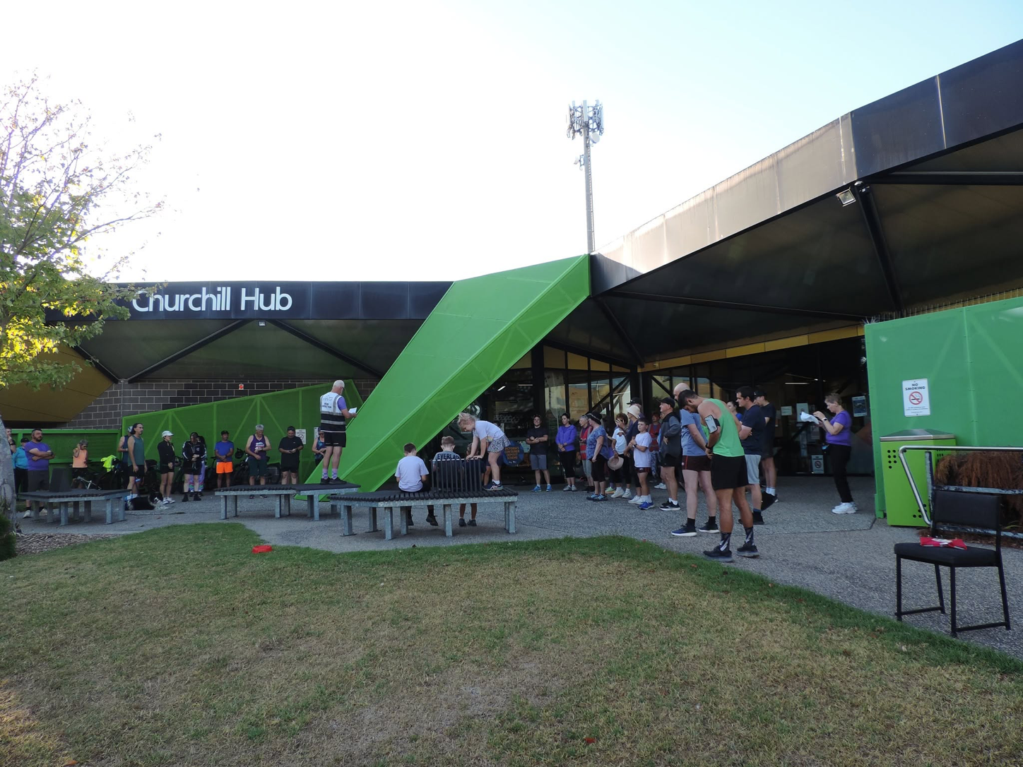 Participants gather outside Churchill Community Hub before Churchill parkrun