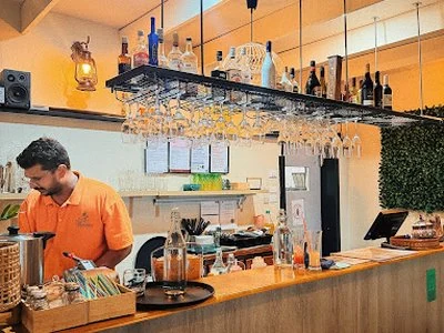 A staff member works behind the bar at Malaio's Restaurant in Traralgon.