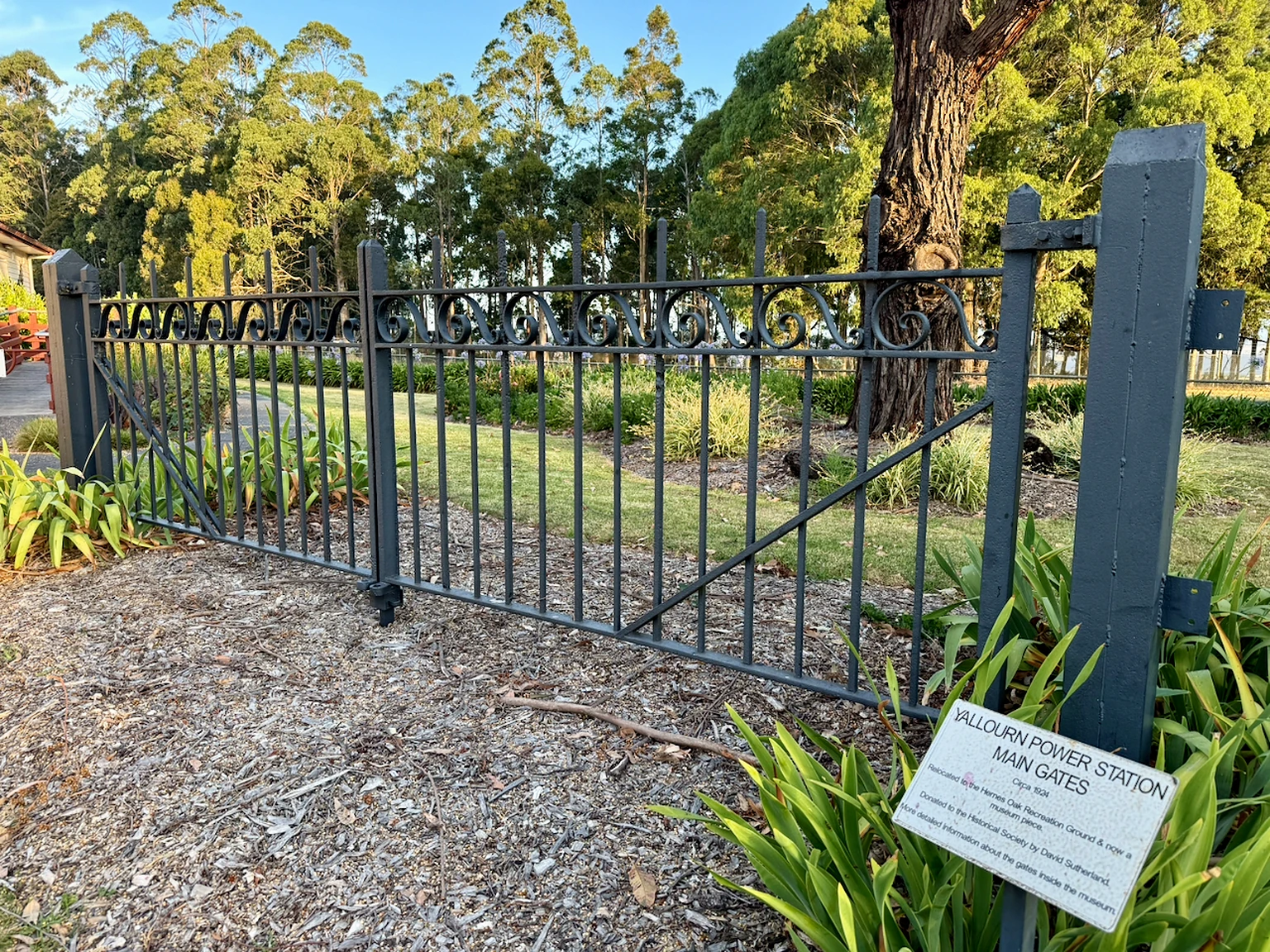 Ornamental metal gates bearing the words Yallourn Power Station.