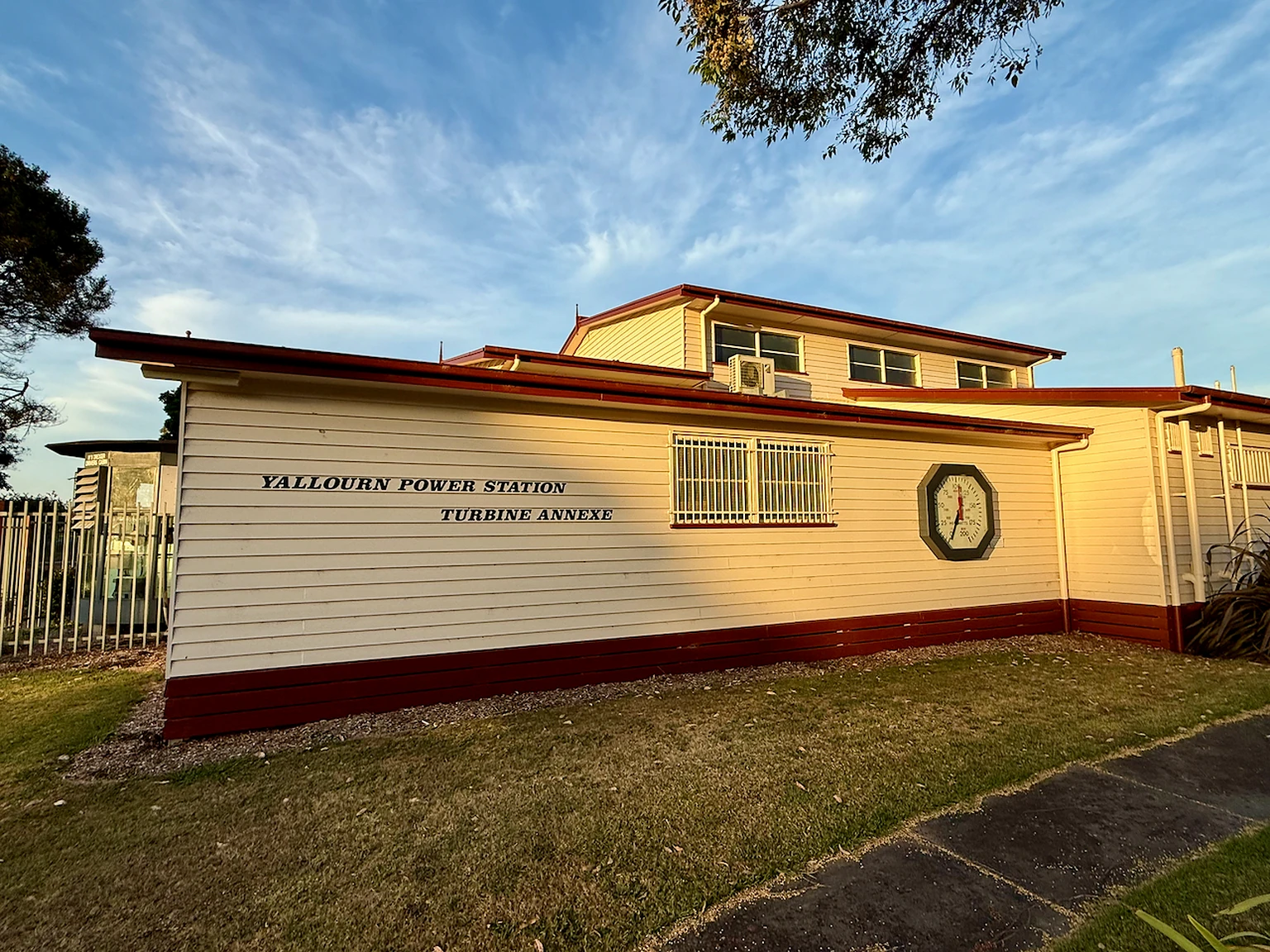 Museum annexe containing turbine equipment and a large industrial gauge.
