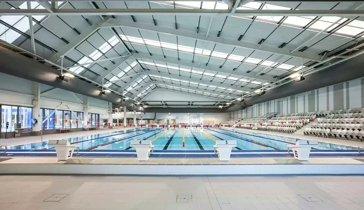 Competition lanes and starting blocks stretch beneath the skylit roof of Gippsland Regional Aquatic Centre.