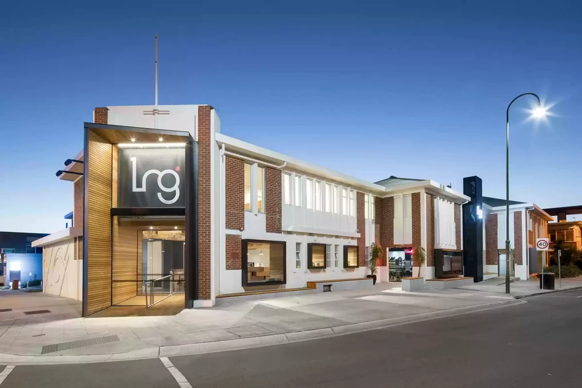 Latrobe Regional Gallery's brick and white exterior illuminated at dusk.