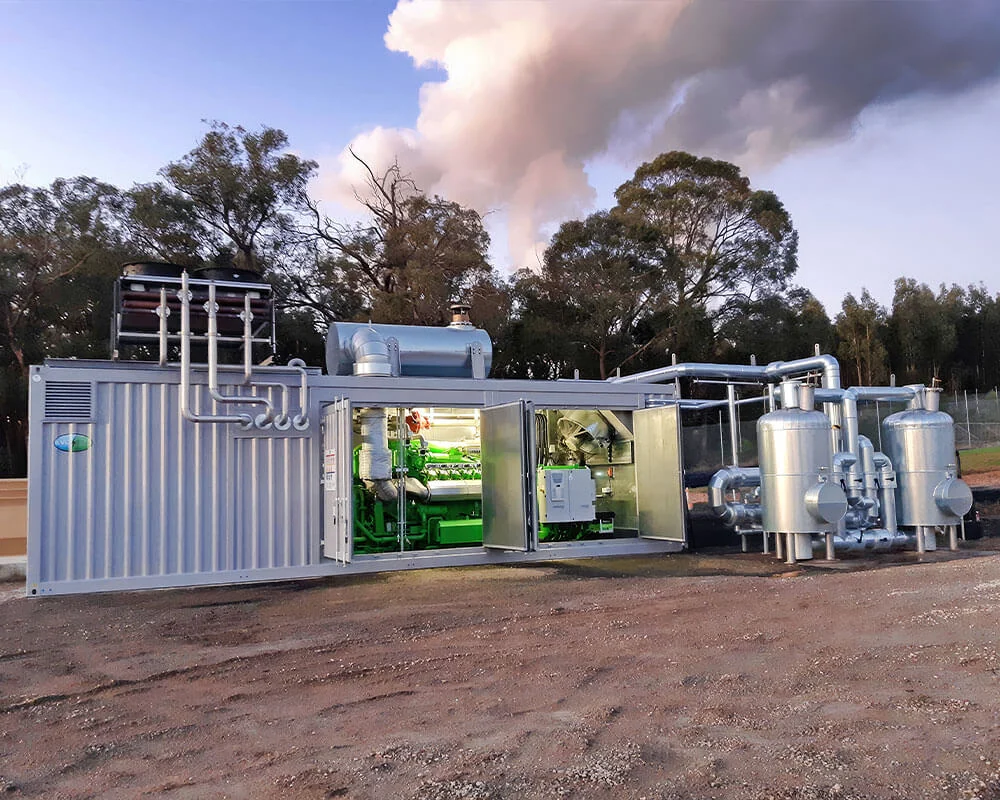 Landfill-gas equipment with its machinery compartment open beside silver pipework.